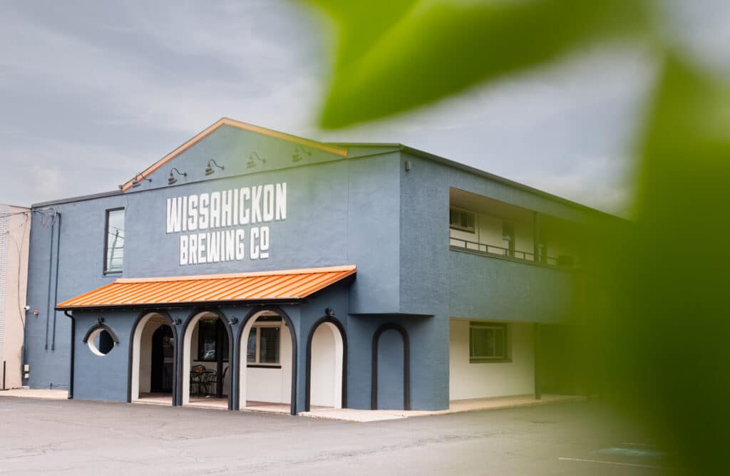 A photo shows an outdoor view of Wissahickon Brewing Company Maple Glen. Wissahickon Brewing Company, Philadelphia, pennsylvania, beer, East Falls, Kensington, Maple Glen. Philadelphia brewery contact us.